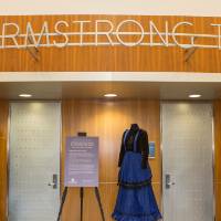 Three costumes on display.